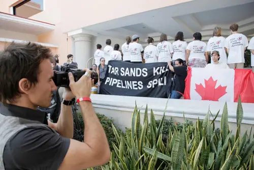 Rob Stewart filming the indigenous environmental network protest at UN Climate Conference, 16TH SESSION OF THE CONFERENCE OF THE PARTIES (COP 16), . Photo © Tristan Bayer Earthnative.com From the documentary film Revolution.